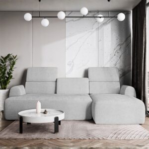 Szary narożnik VALENCIA w eleganckim wnętrzu, pokazany na wprost w pozycji rozłożonej; narożnik z elektrycznie wysuwanym siedziskiem i trzema ruchomymi zagłówkami, w stylu nowoczesnym.