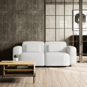Biała sofa ORCHID w gustownej aranżacji salonu, widok od frontu. Wyjątkowy design i delikatna forma doskonale komponują się z nowoczesnym otoczeniem.