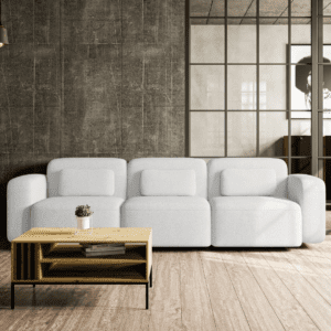 Trzyosobowa sofa ustawiona w przytulnej aranżacji salonu, widok od frontu. Stylowe wzornictwo, delikatna forma i komfortowe siedzisko podkreślają jej wyjątkowy charakter.