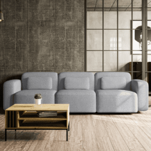 Trzyosobowa sofa w aranżacji salonu, widok od frontu. Wyważony design, subtelne proporcje i komfortowe siedzisko podkreślają jej nowoczesny i przytulny charakter.