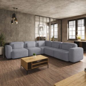 Duży narożnik wieloosobowy w kolorze szarym, ustawiony w stylowej aranżacji wnętrza. Przykład, jak dopasować kolor do salonu.