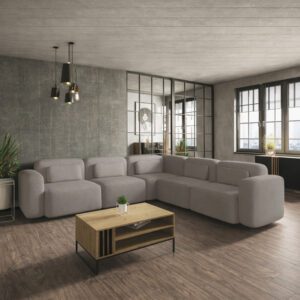 Duży narożnik wieloosobowy w kolorze beżowym, ustawiony w stylowej aranżacji wnętrza. Przykład, jak dopasować kolor do salonu.