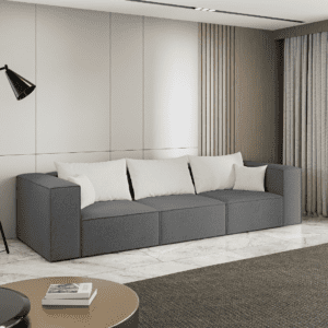 Ciemnoszara sofa w aranżacji salonu, widok z boku. Inspiracyjne zdjęcie podkreślające elegancję i praktyczność.