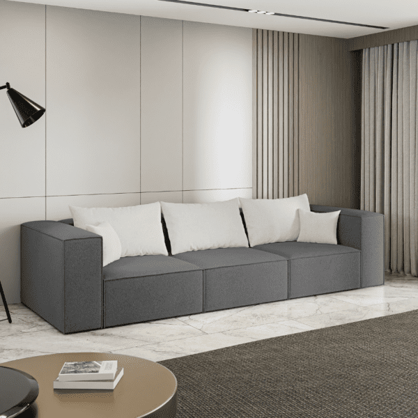 Ciemnoszara sofa w aranżacji salonu, widok z boku. Inspiracyjne zdjęcie podkreślające elegancję i praktyczność.