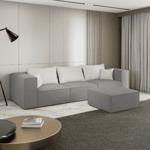 Szara sofa 3-osobowa z pufą w nowoczesnej aranżacji, widok z boku. Obraz inspiracyjny pokazujący prostotę i elegancję.